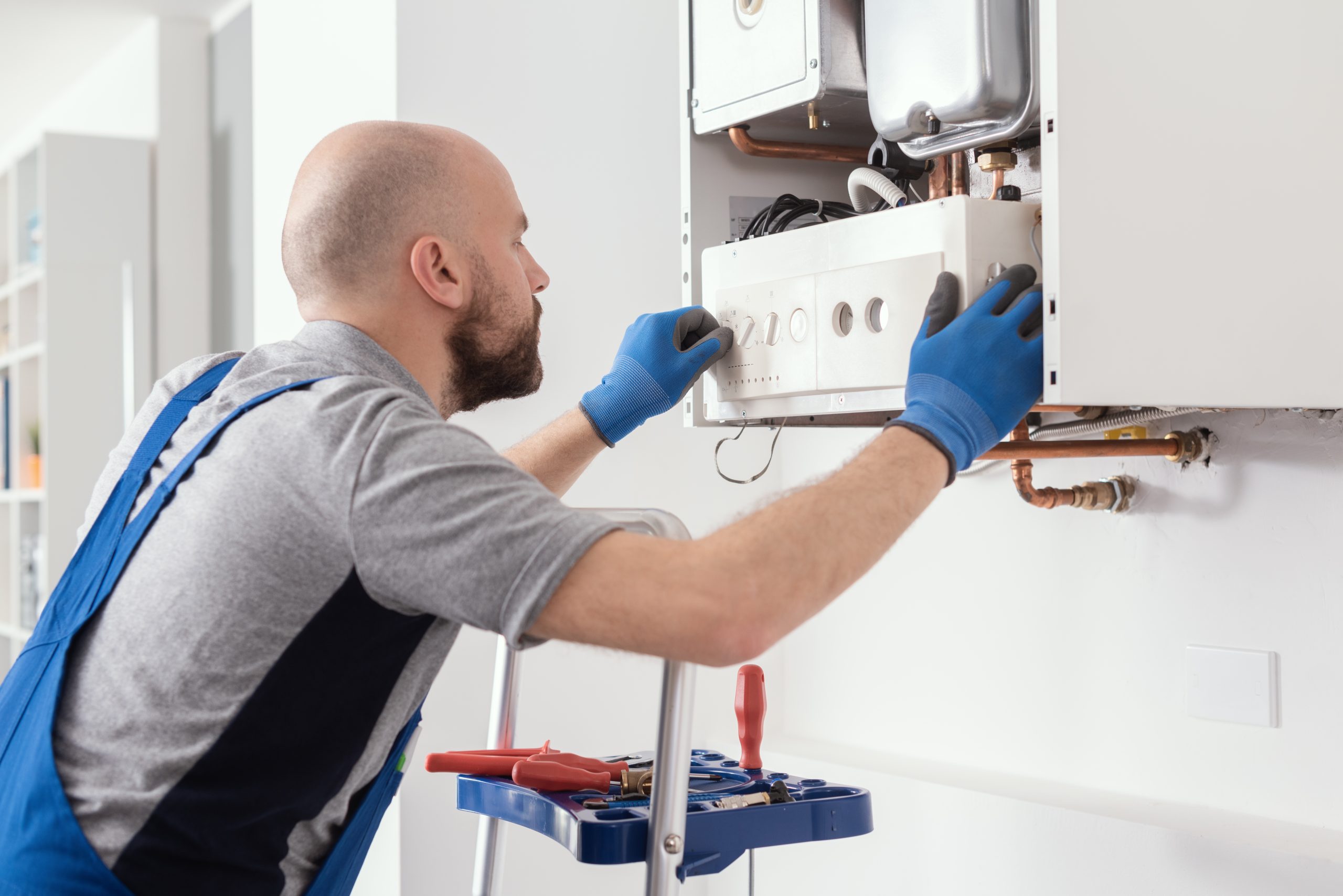 Gas engineer installing a new boiler